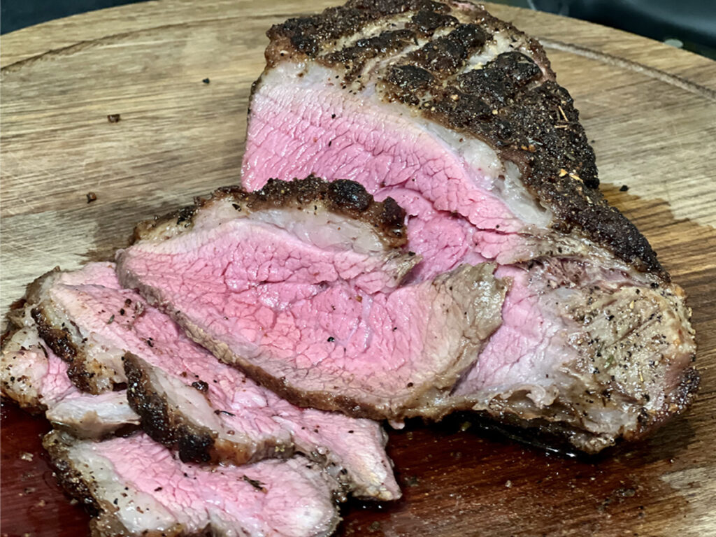 Perfectly cooked slices of medium-rare tri-tip pan-seared oven-finished